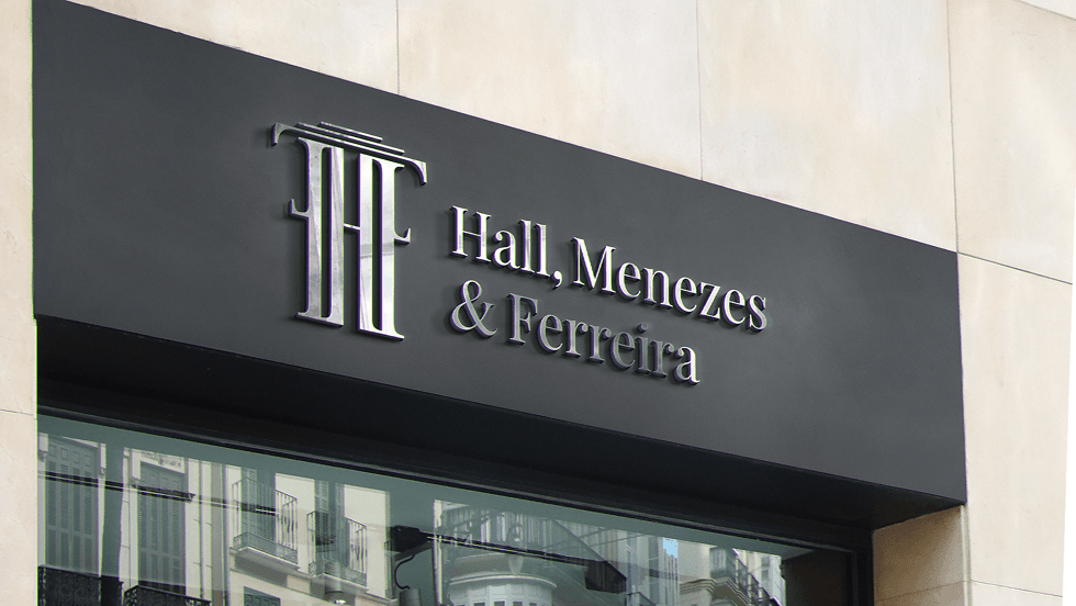 The monogram and the firm's name on the office fascia